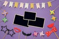 Blank photo frames next to funny party accessories