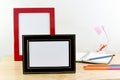 Blank photo frames on wooden table and white background. Royalty Free Stock Photo