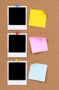 Row polaroid photo frames, post-it style sticky notes cork background vertical Royalty Free Stock Photo