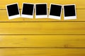 Blank polaroid photo frame prints row wood table background copy space Royalty Free Stock Photo