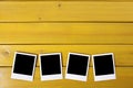 Row polaroid frame photo prints wood table background copy space Royalty Free Stock Photo