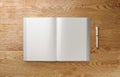 Blank A4 photorealistic book mockup on light wooden table, 3D illustration.