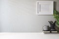 Blank picture frame, coffee cup, notebook and house plant. Home office desk, Copy space for your text Royalty Free Stock Photo