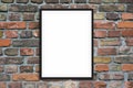 Blank picture frame hanging on brick wall - framed poster mock-up with stone wall background Royalty Free Stock Photo