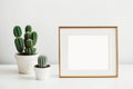 Blank picture frame mockup on desk. Scandinavian minimalist style. Interior items. Generative AI Royalty Free Stock Photo