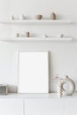 Blank picture frame mockup on white wall. White living room design. View of modern scandinavian style interior Royalty Free Stock Photo