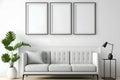 Blank picture frame mockup on white wall. Modern living room design. View of modern scandinavian style interior with sofa. Royalty Free Stock Photo