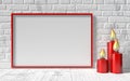 Blank picture frame and red candlestick on white brick wall. Mock up 3D Royalty Free Stock Photo