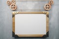 Blank picture frame in the style of steampunk hanging on concrete wall, mock up Royalty Free Stock Photo