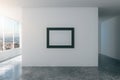 Blank picture frame on white wall in empty loft style room Royalty Free Stock Photo