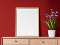 Blank picture frame on wooden cabinet with red wall background 3d render Royalty Free Stock Photo