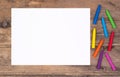 Blank piece of paper with colorful crayons on kid`s desk Royalty Free Stock Photo