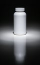 Blank Pill Bottle Under Spot Light Ready For Your Text. Royalty Free Stock Photo