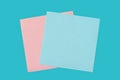 Blank pink and blue paper template on blue background close-up. Royalty Free Stock Photo