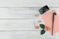 Blank pink card, oblique pen and bottle of ink decorate with pink rose paper flowers Royalty Free Stock Photo