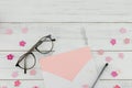 Blank pink card in white envelope, pen and eyeglasses Royalty Free Stock Photo