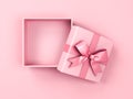 Blank pink pastel color present box or open gift box with pink ribbon and bow isolated on pink pastel color background