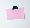 Blank pink sheet of paper stuck with green sticky tape Royalty Free Stock Photo