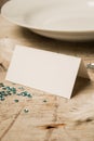 Blank Place Card by a Plate, Gemstones, and Green Sequins