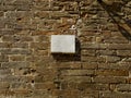 Blank plaque on a brick wall surface. Royalty Free Stock Photo