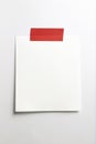 Blank polaroid photo frame with soft shadows and red scotch tape isolated on white paper background as template for graphic Royalty Free Stock Photo