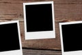 Blank polaroid photos. Vintage frames on the wood. Royalty Free Stock Photo