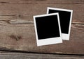 Blank polaroid photos. Vintage frames on the wood. Royalty Free Stock Photo