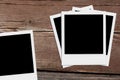 Blank polaroid photos. Vintage frames on the wood. Royalty Free Stock Photo