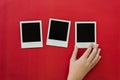 Three blank polaroids with hand Royalty Free Stock Photo