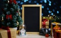 Blank Portrait Blackboard Between Christmas Decoration. Room for