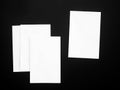 Blank portrait. white paper isolated on black background. Poster mock-ups paper, identity design, set of booklets