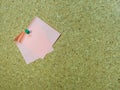 Blank post it note pinned to a cork board / bulletin board Royalty Free Stock Photo