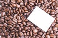 Blank post-it note on roasted organic coffee beans Royalty Free Stock Photo