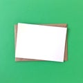 Blank Postcard with Envelope on Green Background