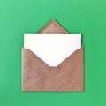 Blank Postcard with Envelope on Green Background