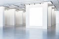 Blank poster mockups in a bright gallery space with overhead lighting, modern design on a white background Royalty Free Stock Photo