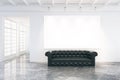 Blank poster on the wall in loft room with black leather sofa an Royalty Free Stock Photo