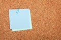 Blank postit note on cork notice board Royalty Free Stock Photo