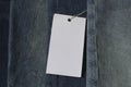 Blank price tag, clothes label mock up on jeans denim cloth