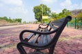 Blank railway sign board, seating bench at railway station platform of an Indian mountain village on a sunny summer day. Indian Royalty Free Stock Photo