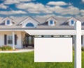 Blank Real Estate Sign in Front of New House Royalty Free Stock Photo