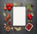 Blank recipe book and ingredients on black table, flat lay. Space for text Royalty Free Stock Photo