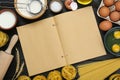 Blank recipe book and different ingredients on black wooden table, flat lay. Space for text Royalty Free Stock Photo