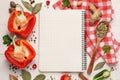 Blank recipe book and different ingredients on white wooden table, flat lay. Space for text Royalty Free Stock Photo