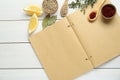 Blank recipe book and different ingredients on white wooden table, flat lay. Space for text Royalty Free Stock Photo