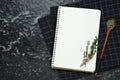 Blank recipe book and thyme on black textured table. Space for text Royalty Free Stock Photo