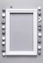 A blank rectangular frame rests on a soft gray background, surrounded by circular and rolled gray and white elements for Royalty Free Stock Photo