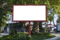 Blank red billboard on blue sky background for new advertisement in city Royalty Free Stock Photo