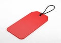 Blank red luggage tag with black string on a white background Royalty Free Stock Photo