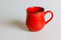 Blank red mug isolated on white background,mat tea or coffee cup,mock up with ceramic mug for hot drinks,empty gift print branding Royalty Free Stock Photo